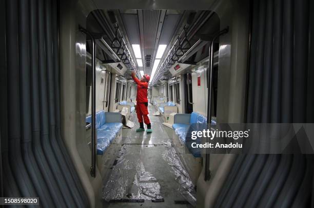 An employee completing work Light Rapid Transit train carriage at Jati Mulya Depo Station in Bekasi, West Java province, Indonesia on July 06, 2023....