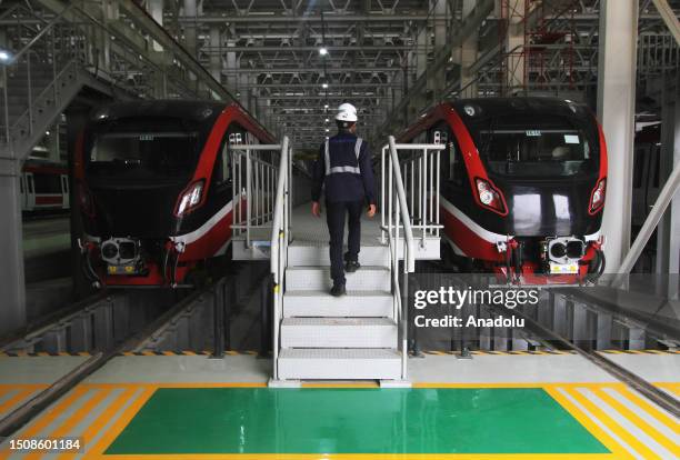 An employee completing work Light Rapid Transit train carriage at Jati Mulya Depo Station in Bekasi, West Java province, Indonesia on July 06, 2023....