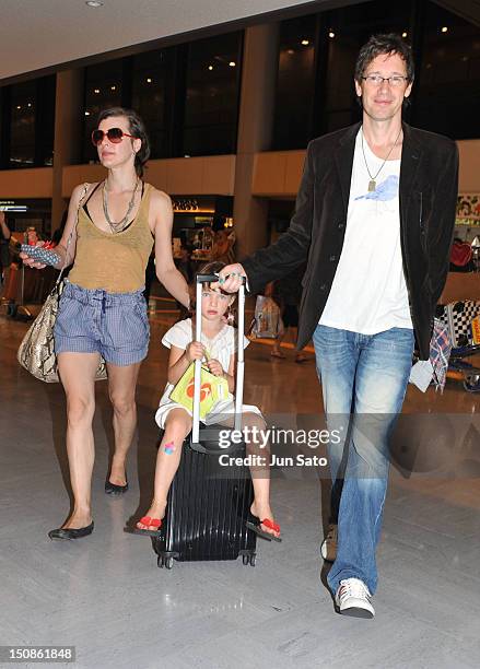 Actress Milla Jovovich, Ever Anderson and producer Paul W. S. Anderson arrive at Narita International Airport on August 28, 2012 in Narita, Japan.