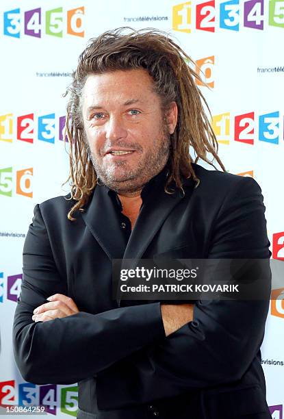 French journalist Olivier Delacroix poses during a photocall following the France Televisions new season press conference at the group's headquarters...