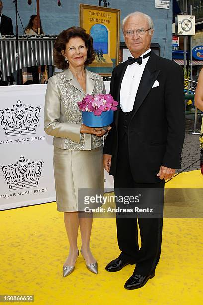 Queen Silvia of Sweden and King Carl XVI Gustaf of Sweden arrive for the Polar Music Prize at Konserthuset on August 28, 2012 in Stockholm, Sweden.