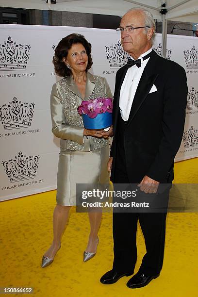 Queen Silvia of Sweden and King Carl XVI Gustaf of Sweden arrive for the Polar Music Prize at Konserthuset on August 28, 2012 in Stockholm, Sweden.