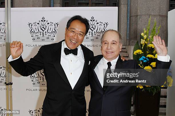 Cellist Yo-Yo Ma and artist Paul Simon arrive for the Polar Music Prize at Konserthuset on August 28, 2012 in Stockholm, Sweden.