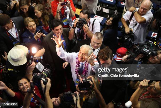 Rep. Ron Paul walks the arena floor during the second day of the Republican National Convention at the Tampa Bay Times Forum on August 28, 2012 in...