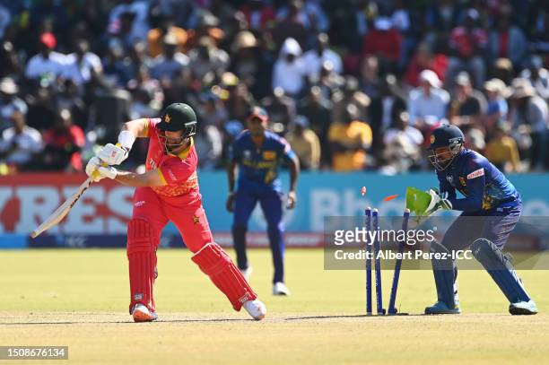 Ryan Burl of Zimbabwe is bowled by Maheesh Theekshana of Sri Lanka during the ICC Men's Cricket World Cup Qualifier Zimbabwe 2023 Super 6 match...