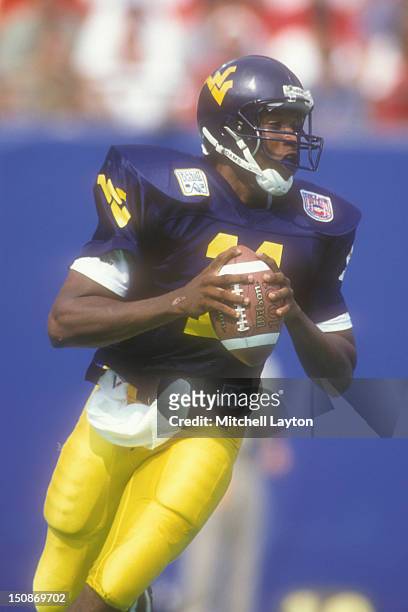 Eric Boykin of the West Virginia Mountaineers looks to throw a pass during a college football game against the Nebraska Cornhuskers on August 31,...