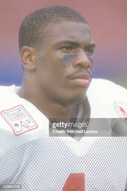 Lawrence Phillips of the Nebraska Cornhuskers looks on during a college football game against the West Virginia Mountaineers on August 31, 1994 at...