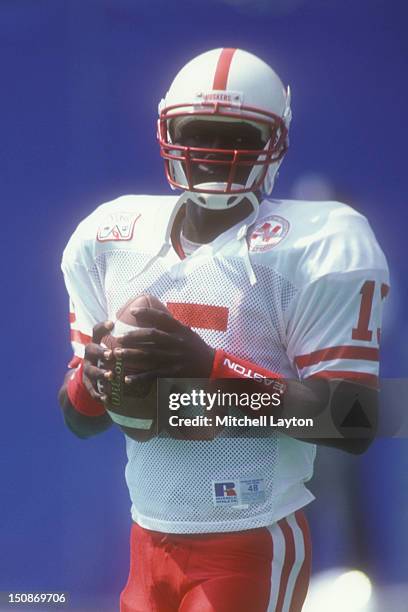 Tommy Frazier of the Nebraska Cornhuskers warms up before a college football game against the West Virginia Mountaineers on August 31, 1994 at Giants...