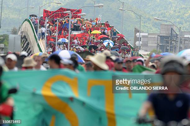 Workers and users of the state-owned Empresa Nacional de Energia Electrica , march demanding to the government not to expand the contracts with the...