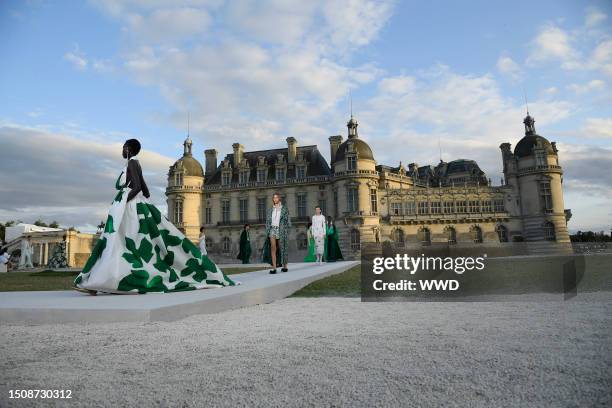 Model on the runway at the Valentino Fall 2023 Couture Collection Fashion Show at Chateau de Chantilly on July 5, 2023 in Paris, France.