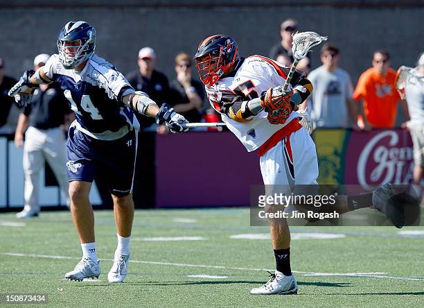 Casey Cittadino of the Denver Outlaws shoots as Drew Westervelt of the Chesapeake Bayhawks defends during the Major League Lacrosse Championship Game...
