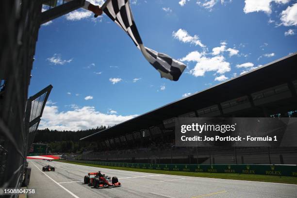 Race winner Richard Verschoor of Netherlands and Van Amersfoort Racing takes the chequered flag during the Round 8:Spielberg Feature race of the...