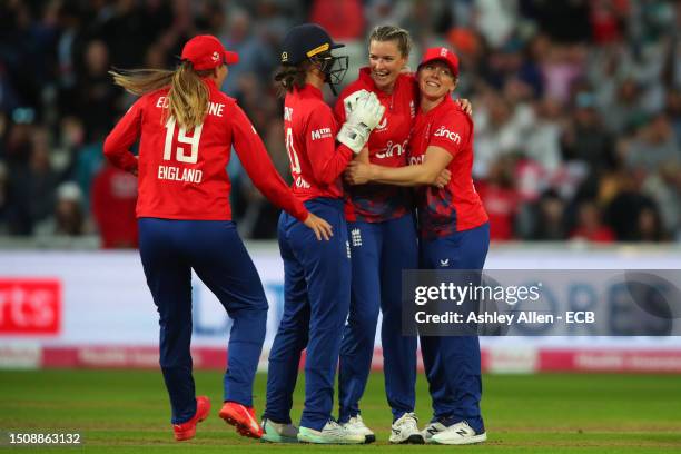 Lauren Bell, Heather Knight, Amy Jones and Sophie Ecclestone of England celebrate the wicket of Ellyse Perry of Australia during the Women's Ashes...