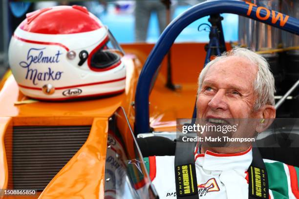 Red Bull Racing Team Consultant Dr Helmut Marko prepares to drive a BRM 157 in the Red Bull Legends Parade prior to the F1 Grand Prix of Austria at...