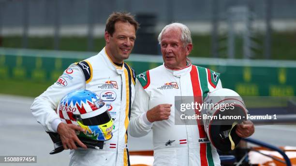 Red Bull Racing Team Consultant Dr Helmut Marko and Alexanader Wurz talk after the Red Bull Legends Parade prior to the F1 Grand Prix of Austria at...