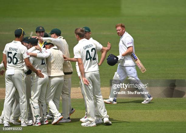 England batsman Jonny Bairstow leaves the field past the celebrating Australia fielders after being given out during the 5th day of the LV=Insurance...