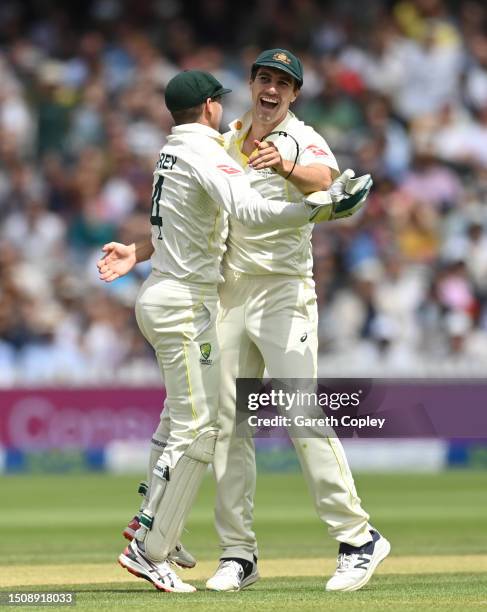 Pat Cummins of Australia and Alex Carey of Australia celebrates the wicket of Jonny Bairstow of England during Day Five of the LV= Insurance Ashes...