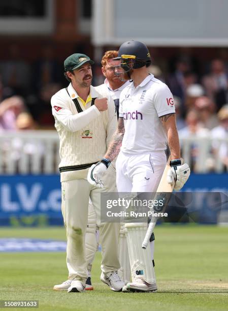 Travis Head of Australia speaks with Ben Stokes of England after Jonny Bairstow of England was run out by Alex Carey of Australia during Day Five of...