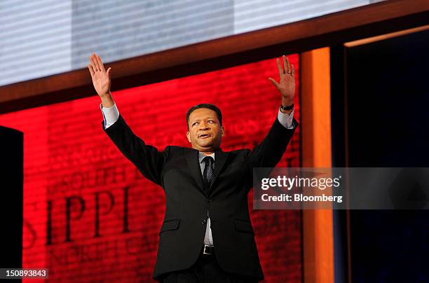 Artur Davis, former Representative of Alabama, waves before speaking at the Republican National Convention in Tampa, Florida, U.S., on Tuesday, Aug....