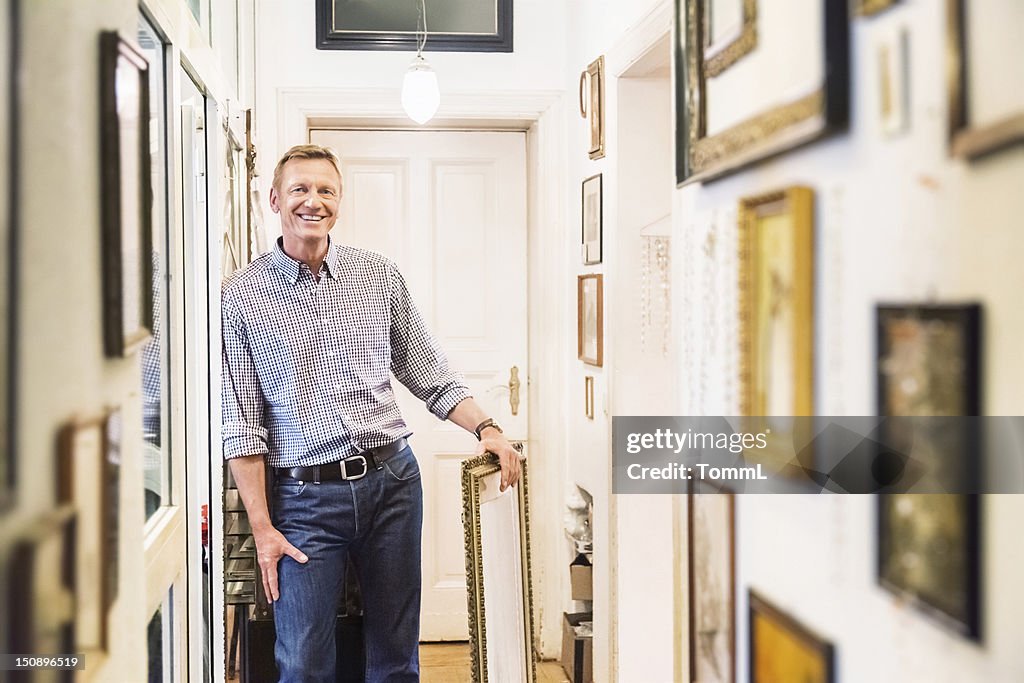 Art Collector in old Apartment Corridor