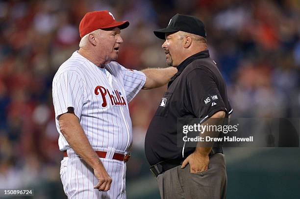 Manager Charlie Manuel of the Philadelphia Phillies argues a call with umpire Wally Bell during the game against the New York Mets at Citizens Bank...