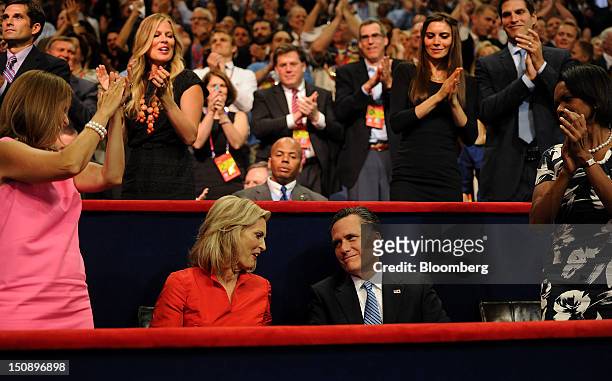 Mitt Romney, Republican presidential candidate, second right, and wife Ann Romney, second left, sit while Condoleezza Rice, former U.S. Secretary of...