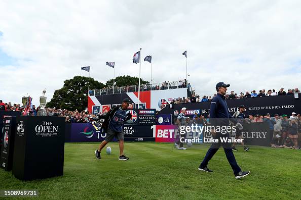 A general view as Justin Rose of England walks past the British