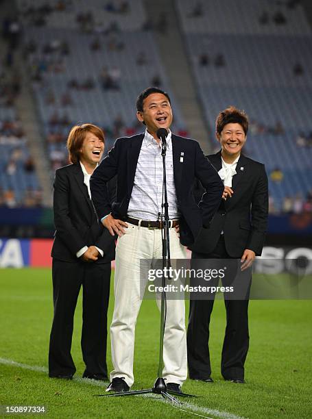 Japan Women's national team head coach Norio Sasaki speaks while Aya Miyama and Miho Fukumoto smile prior to the FIFA U-20 Women's World Cup Group A...