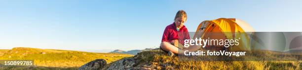 child reading idyllic summer camp sunset panorama - endast flickor bildbanksfoton och bilder