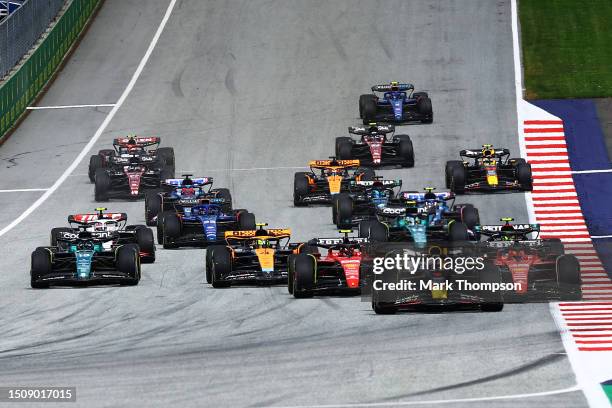 Max Verstappen of the Netherlands driving the Oracle Red Bull Racing RB19 leads the field into turn one at the start during the F1 Grand Prix of...