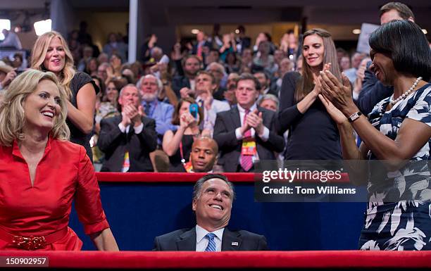 Mitt Romney, republican presidential nominee, receives applause from his wife Ann, left, and Condoleeza Rice, former Secretary of State, after Ann,...