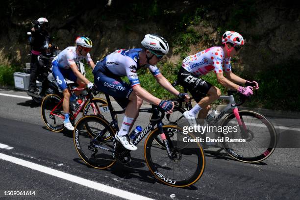 Edvald Boasson-Hagen of Norway and Team TotalEnergies, Remi Cavagna of France and Team Soudal - Quick Step and Neilson Powless of The United States...
