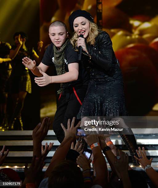 Rocco Ritchie and Madonna perform during the MDNA North America tour opener at the Wells Fargo Center on August 28, 2012 in Philadelphia,...