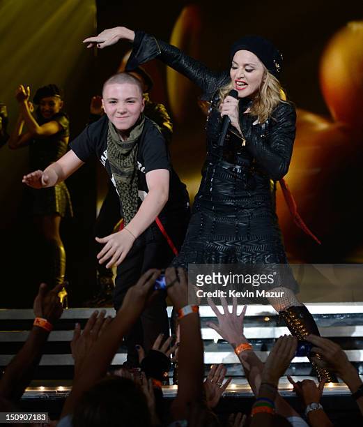 Rocco Ritchie and Madonna perform during the MDNA North America tour opener at the Wells Fargo Center on August 28, 2012 in Philadelphia,...