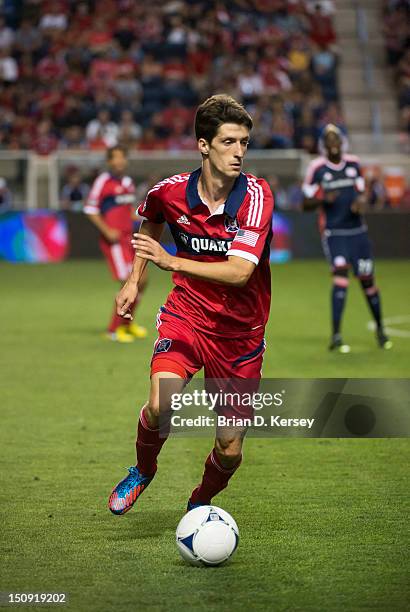 Alvaro Fernandez of Chicago Fire moves the ball against the New England Revolution at Toyota Park on August 18, 2012 in Bridgeview, Illinois. The...