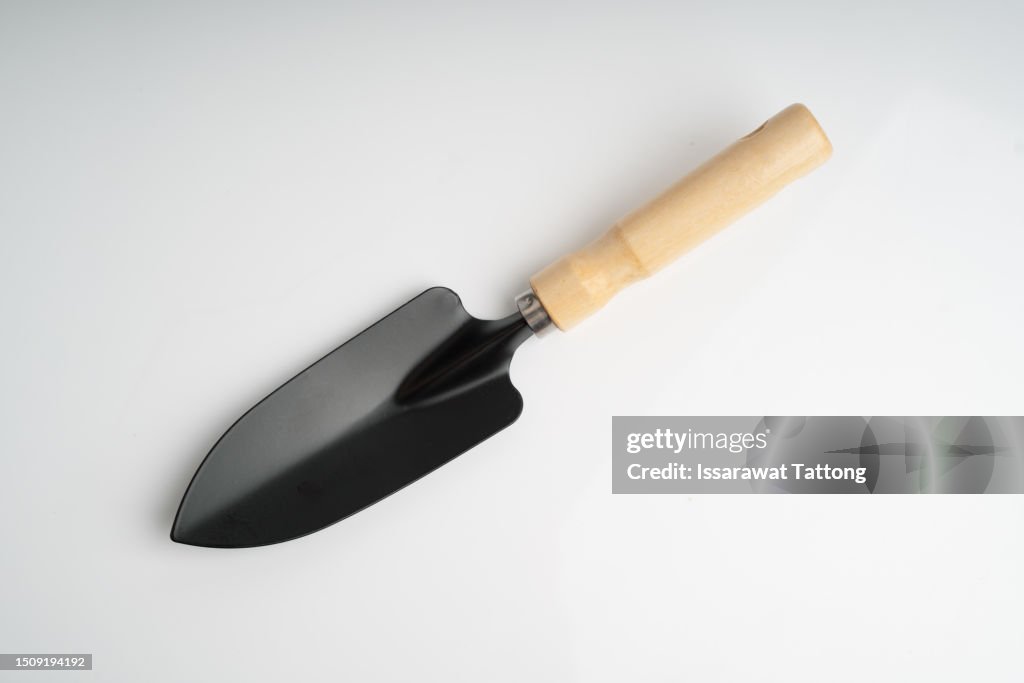 Metal shovels for gardening on white background