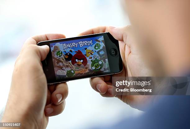 The ''Angry Birds'' mobile-phone game, designed by Rovio Mobile Oy is seen on an Apple Inc. IPhone 4 smartphone in this arranged photograph in...