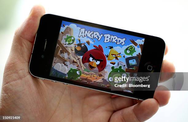 The ''Angry Birds'' mobile-phone game, designed by Rovio Mobile Oy is seen on an Apple Inc. IPhone 4 smartphone in this arranged photograph in...
