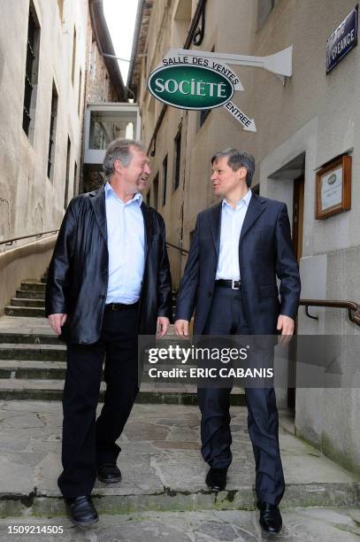 Commissioner for Agriculture and Rural Development, Romania's Dacian Ciolos , talks to Green Ecology party member Jose Bove after visiting a...