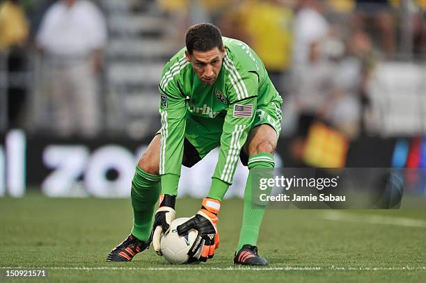 Goalkeeper Andy Gruenebaum of the Columbus Crew controls the ball against the New England Revolution on August 25, 2012 at Crew Stadium in Columbus,...