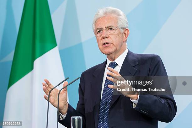 Italian Prime Minister Mario Monti speaks during a press conference with German Chancellor Angela Merkel at the German federal Chancellory on August...