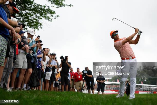 Rickie Fowler of the United States plays his shot on the tenth hole during the final round of the Rocket Mortgage Classic at Detroit Golf Club on...