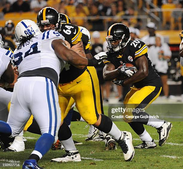 Running back Baron Batch of the Pittsburgh Steelers runs with the football as offensive lineman Doug Legursky blocks defensive lineman Drake Nevis of...