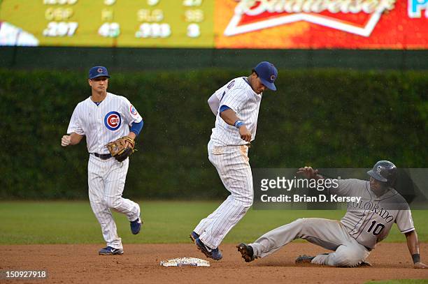 Shortstop Starlin Castro of the Chicago Cubs forces out Chris Nelson of the Colorado Rockies at Wrigley Field on August 26, 2012 in Chicago,...