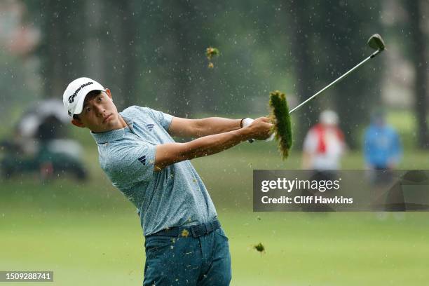 Collin Morikawa of the United States plays his second shot on the 13th hole during the final round of the Rocket Mortgage Classic at Detroit Golf...