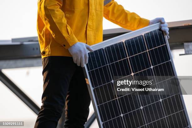 engineer working on replacement solar panel in solar power plant. - replacement stock pictures, royalty-free photos & images