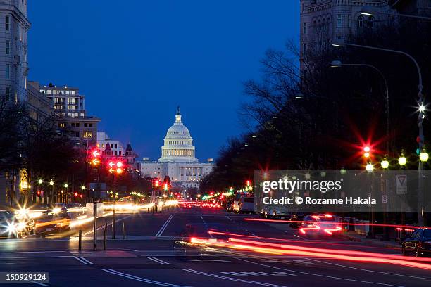 light trails at rush hour in washington - washington dc capitol fotografías e imágenes de stock