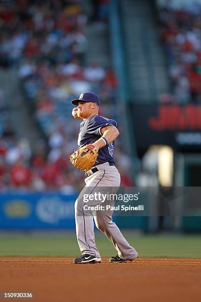 Brooks Conrad of the Tampa Bay Rays throws the ball to first base between innings during the game against the Los Angeles Angels of Anaheim on July...