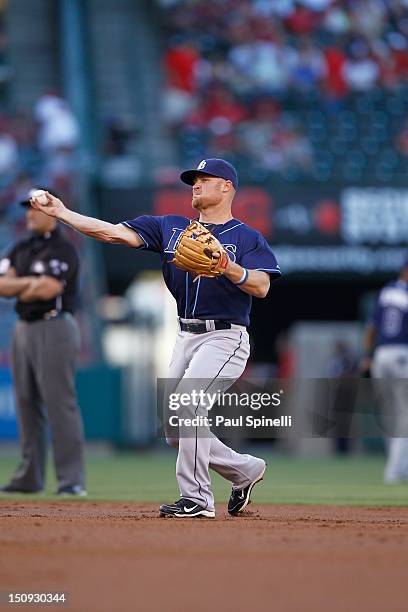 Brooks Conrad of the Tampa Bay Rays throws the ball to first base between innings during the game against the Los Angeles Angels of Anaheim on July...