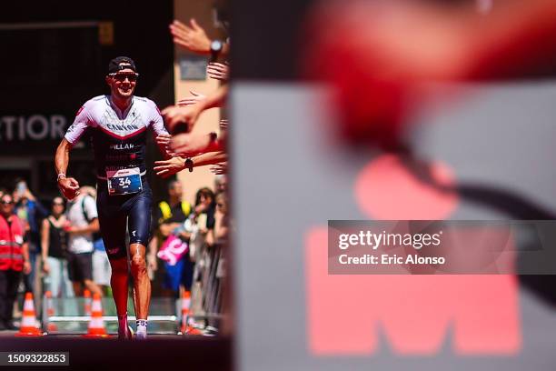 Jan Frodeno of Germany celebrates winning the men's IRONMAN 70.3 Andorra on July 02, 2023 in Andorra la Vella, Andorra.